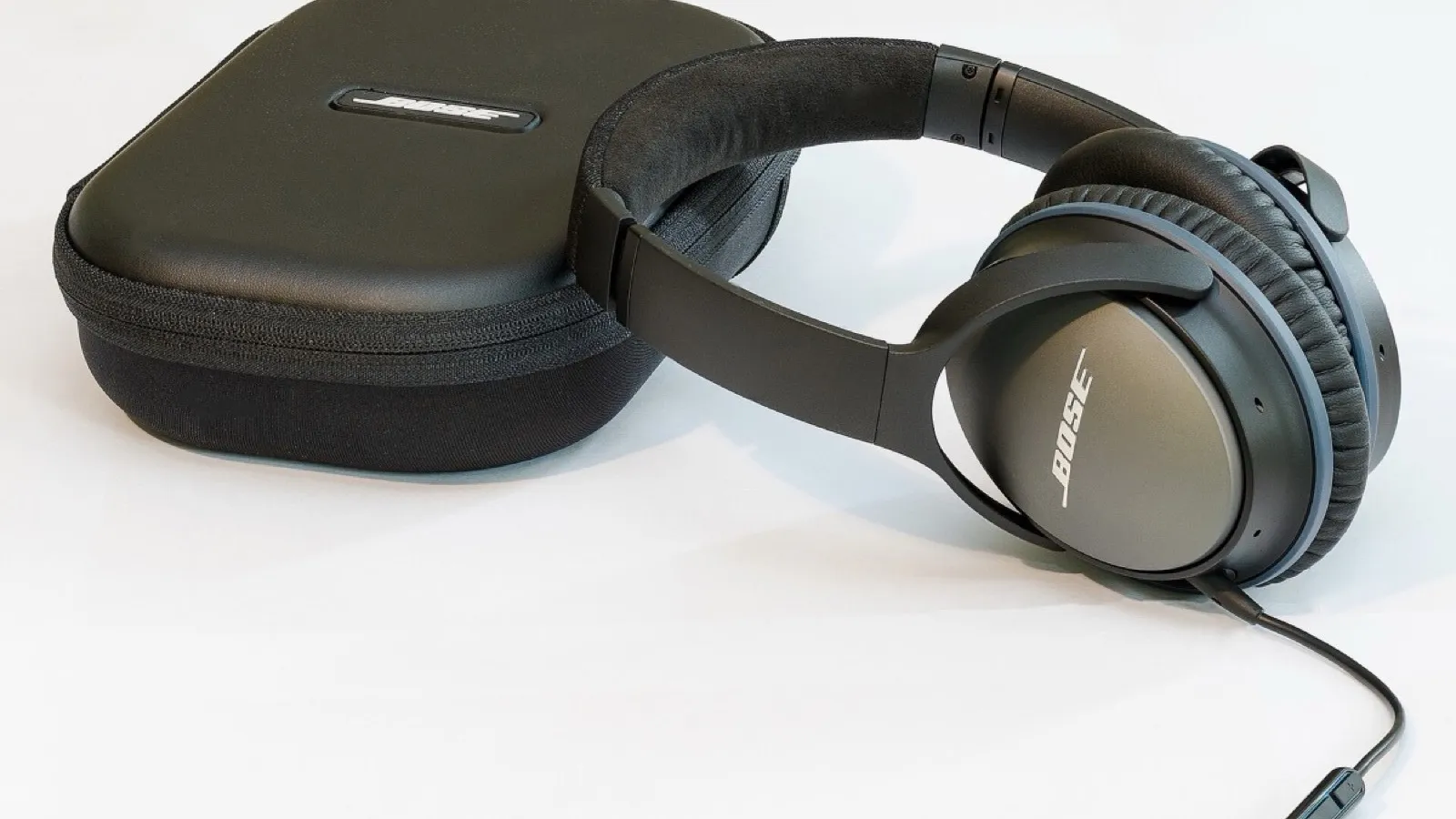 Headphones on a table, how a six-year-old reaches ideas their reading cannot.