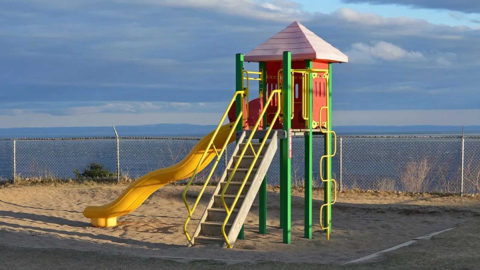 A playground slide, a push and a pull a six-year-old can feel.