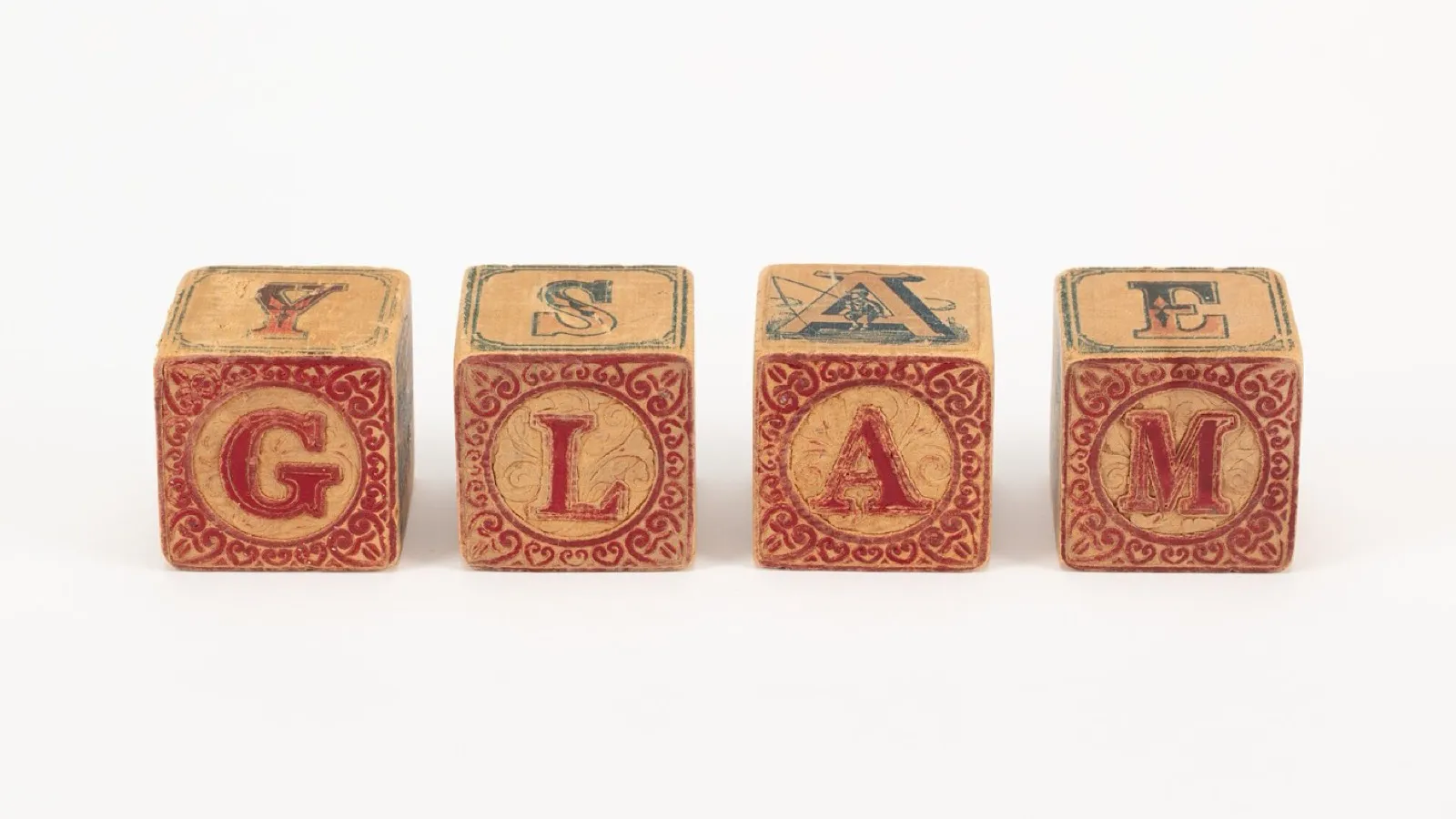 Wooden alphabet blocks: letters as sounds before they are names.