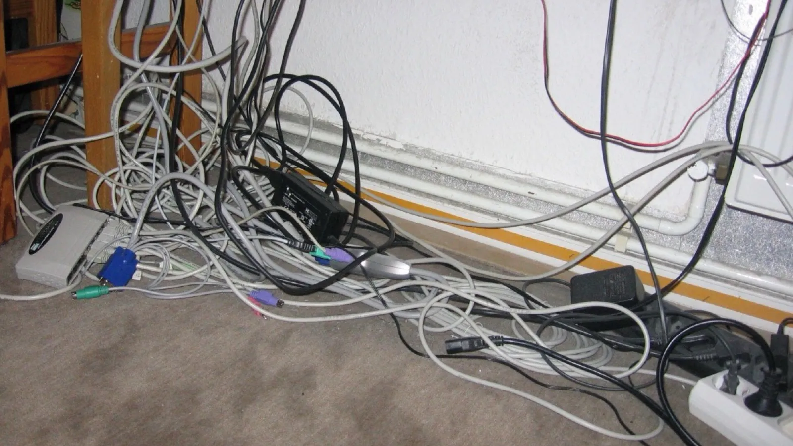 A tangle of cables, the shape of six tools that each know a fragment.