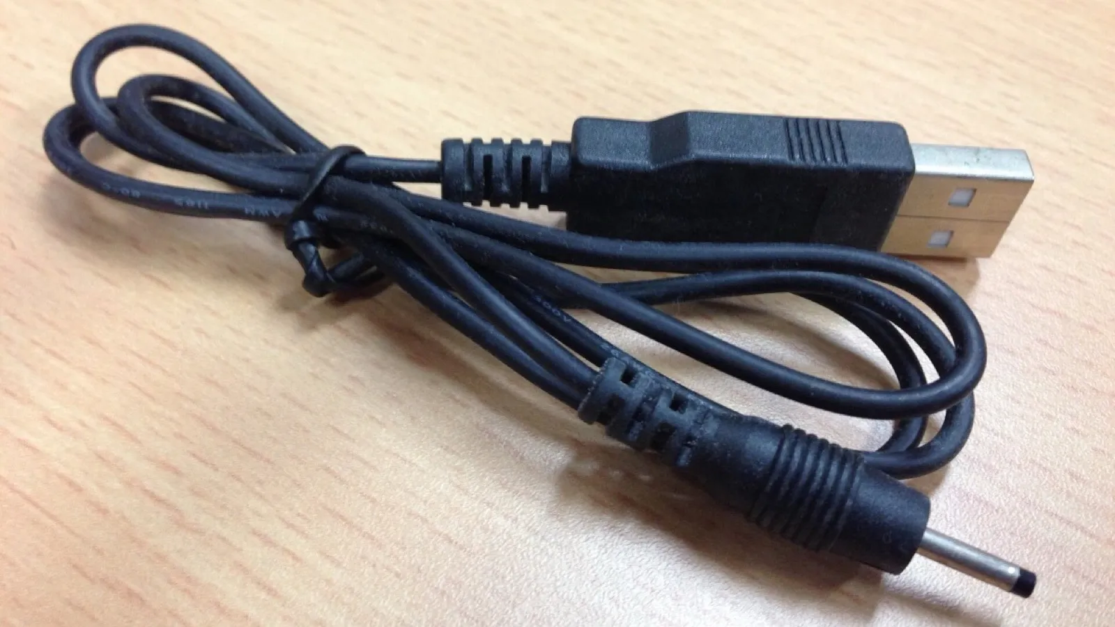 A charging cable, a rule the device holds rather than a parent.