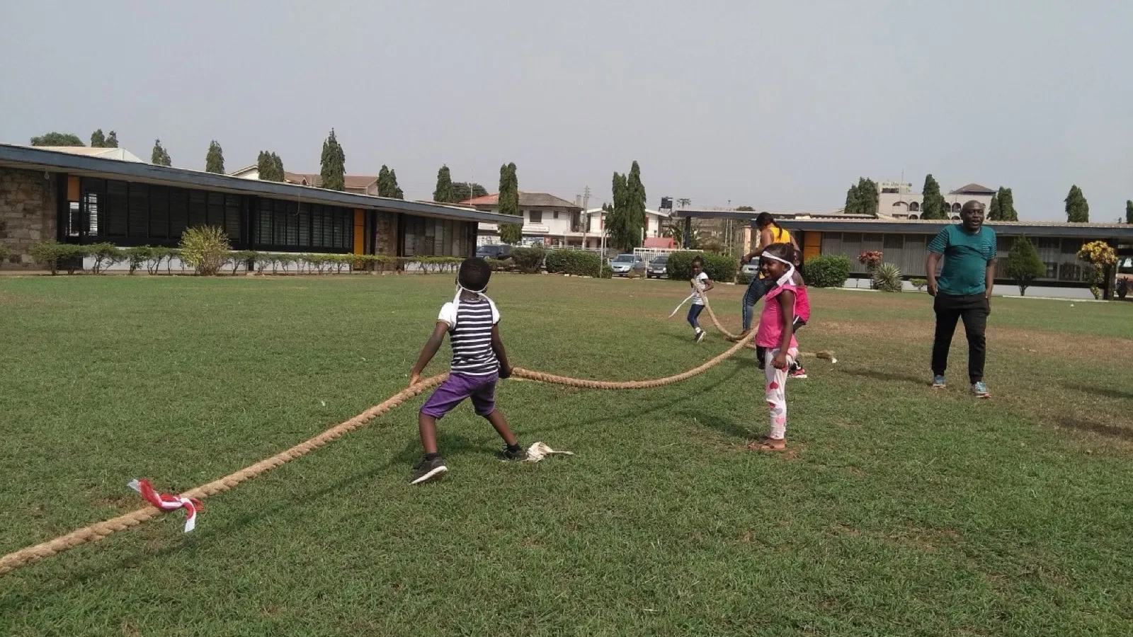 Two teams pulling a rope in opposite directions, forces that balance until one side wins. Photo: Joy Agyepong, CC BY-SA 4.0, via Wikimedia Commons.